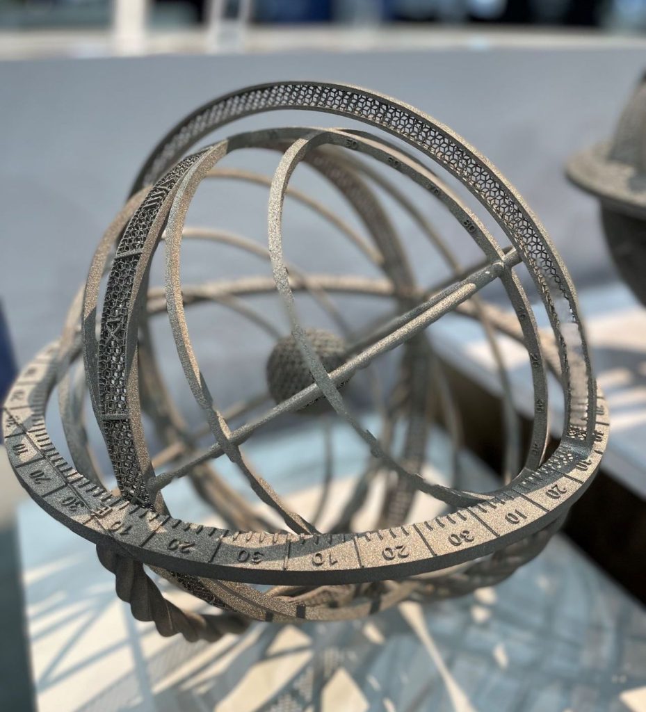 The first image shows an astrolabe printed without Point Melt, the second shows the same part 3D printed using Point Melt without supports. Photo via Colibrium Additive on LinkedIn