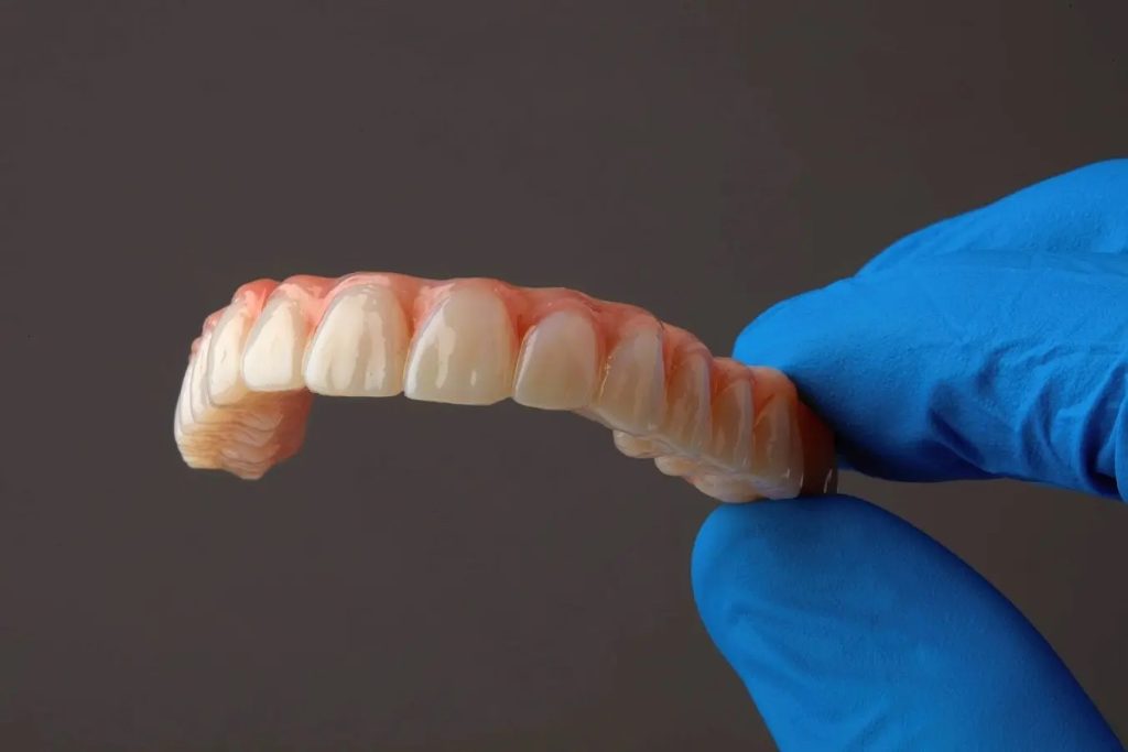 Dental component 3D printed using Formlab Dental's Premium Teeth Resin. Photo via Formlabs.