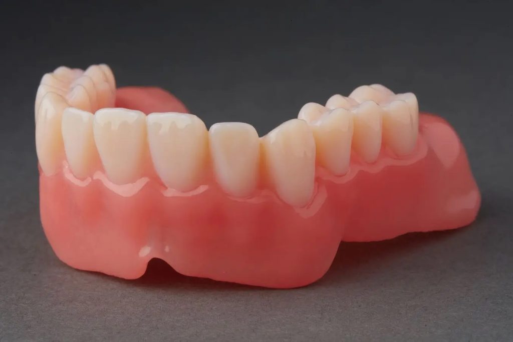 Dental component 3D printed using Formlab Dental's Premium Teeth Resin. Photo via Formlabs.